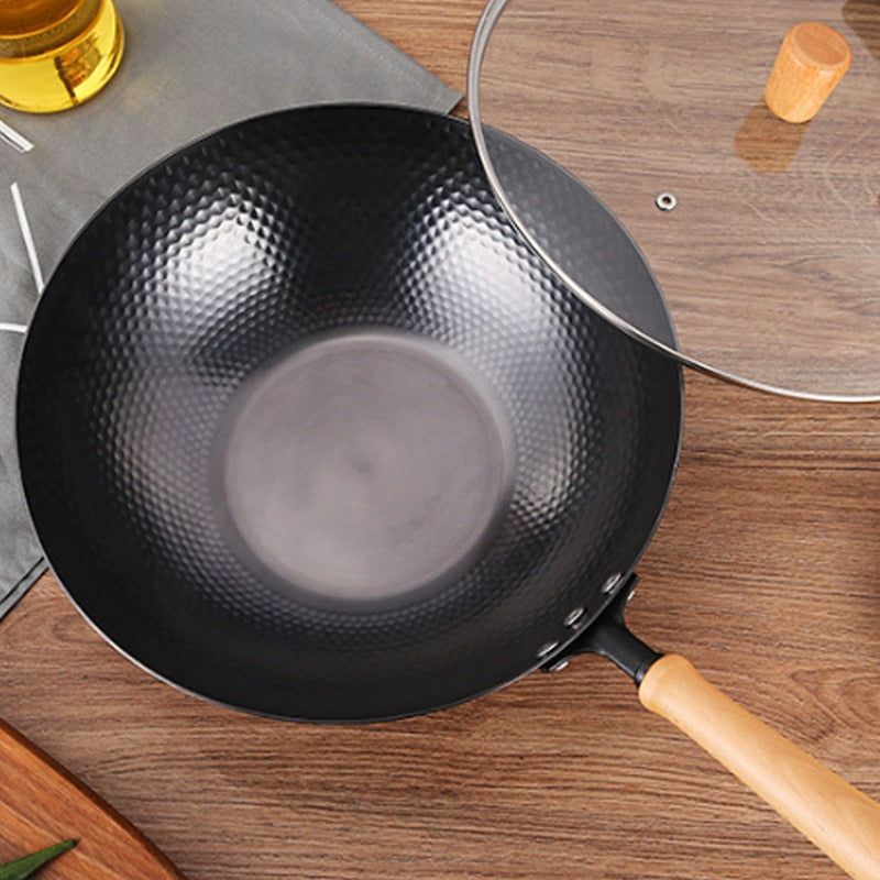 Le Kumichi Wok Carbonstahl Flacher Boden seitlich mit stabilem Standboden