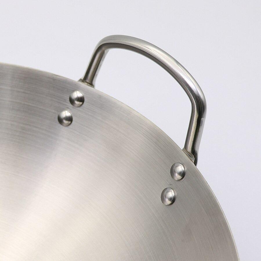 Le Yakushi Induktions-Wok mit Detail des runden Bodens und Griffs