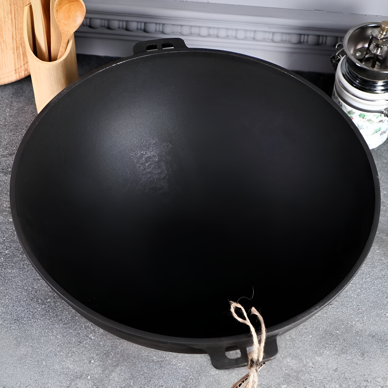 Le Manaka induktionsgeeigneter Gusseisen-Wok Verpackung mit Lieferumfang