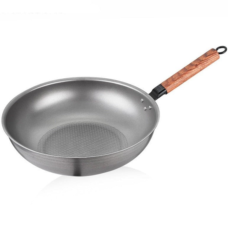 Le Homika Edelstahl-Wok Pro mit ergonomischem Griff und polierter Materialoberfläche
